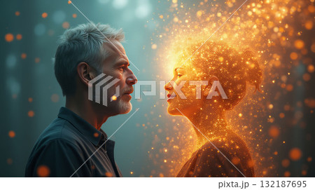 A man and a woman facing each other, glowing orange particles radiating from the woman, on a blurred teal background, symbolizing connection. Mental health concept. 132187695