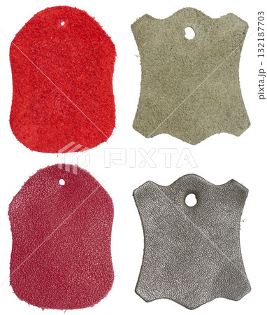 Four isolated samples of genuine leather tags with a hole Four isolated samples of genuine leather tags with a hole 132187703