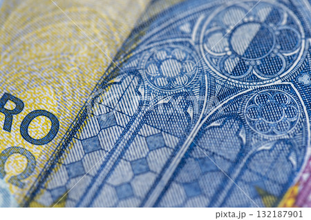Details of the new blue twenty euro of the European Union , part of the genuine 20 euro blue banknote, close up Details of the new blue twenty euro of the European Union , part of the genuine 20 euro blue banknote, close up 132187901