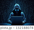Hacker in Hoodie Working on Laptop in Dark Room 132188078