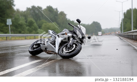 Motorcycle accident on a rainy day along a deserted highway 132188194
