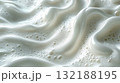 Creamy froth swirls in a textured pattern revealing rich, white texture 132188195