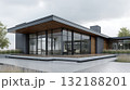 Modern house design with large windows and wood accents in a serene space 132188201