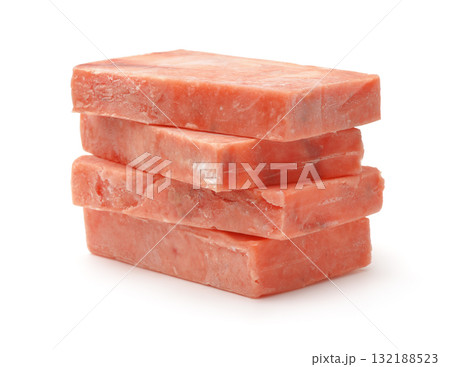Stack of raw frozen salmon fillet blocks 132188523