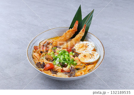 Traditional Japanese ramen with shrimp tempura, boiled egg, and vegetables Traditional Japanese ramen with shrimp tempura, boiled egg, and vegetables 132189535