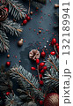 Christmas black background with a bunch of red and green decorations. Copy place 132189941