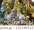 A festive and cosy indoor scene featuring a Christmas or Winter holiday display, likely within a hotel lobby 132190312