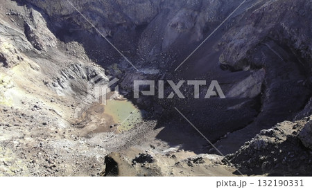 Aerial view of a volcanic crater lake. Media 132190331