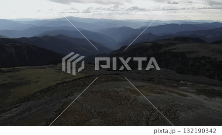 Drone flying over a stunning mountain range valley. Media Drone flying over a stunning mountain range valley. Media 132190342