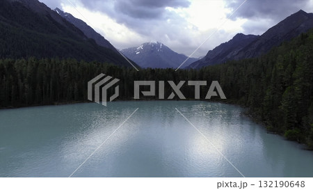 Turquoise lake nestled in the heart of snow-capped mountains. Media 132190648