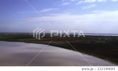 Aerial view of pink salt lake and agricultural fields. Media Aerial view of pink salt lake and agricultural fields. Media 132190683