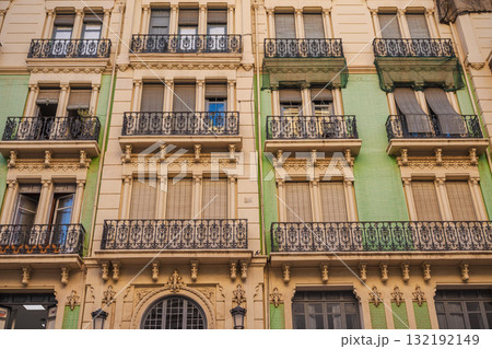 Art Nouveau building facade with wrought iron balconies and decorative stucco details in Alicante, Spain Art Nouveau building facade with wrought iron balconies and decorative stucco details in Alicante, Spain 132192149