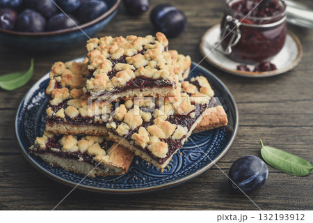 Traditional German Zwetschgenkuchen on blue plate Traditional German Zwetschgenkuchen on blue plate 132193912