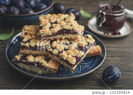 Traditional German Zwetschgenkuchen on blue plate Traditional German Zwetschgenkuchen on blue plate 132193914