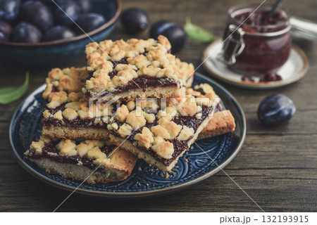 Traditional German Zwetschgenkuchen on blue plate Traditional German Zwetschgenkuchen on blue plate 132193915