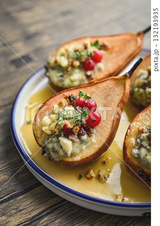 Delicious baked pears with nuts, blue cheese, thyme, cranberry and honey Delicious baked pears with nuts, blue cheese, thyme, cranberry and honey 132193935