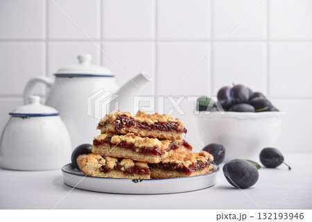 Traditional German Zwetschgenkuchen on white plate Traditional German Zwetschgenkuchen on white plate 132193946