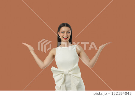 Woman in a white dress showcasing excitement for shopping deals Woman in a white dress showcasing excitement for shopping deals 132194043
