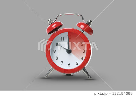 Red alarm clock showing time just before daylight saving change 132194099