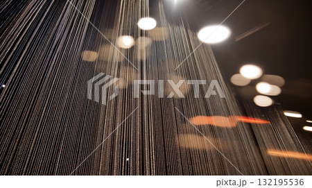 Abstract light trails and bokeh with vertical streaks in a dark atmosphere Abstract light trails and bokeh with vertical streaks in a dark atmosphere 132195536