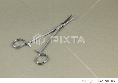 Surgical scissors resting on a simple surface in a clinical setting 132196163
