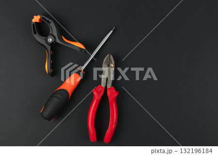 Tools for DIY projects on a black surface 132196184