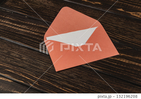 Colorful envelope placed on a wooden table showcasing creativity and craft 132196208