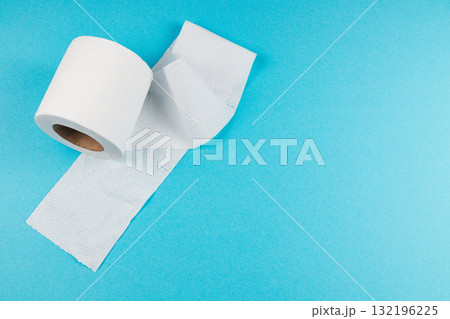 Roll of white toilet paper on a blue background Roll of white toilet paper on a blue background 132196225