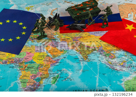 Military figures on a world map highlighting global tensions among nations 132196234