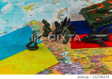 Military miniatures depict conflict between Ukraine and Russia on a world map 132196235