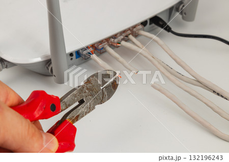 Cutting wires for network connection in a home office setup 132196243