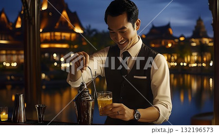 Smiling bartender mixing cocktail at lakeside bar at night Smiling bartender mixing cocktail at lakeside bar at night 132196573