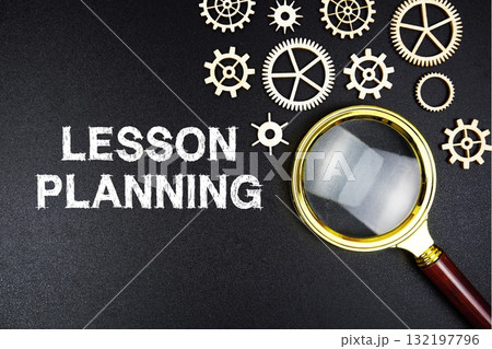 Lesson Planning text message with magnifying glass on black background Lesson Planning text message with magnifying glass on black background 132197796