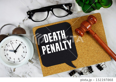 Death Penalty text on speech bubble with alarm clock and wooden gavel on marble background Death Penalty text on speech bubble with alarm clock and wooden gavel on marble background 132197868