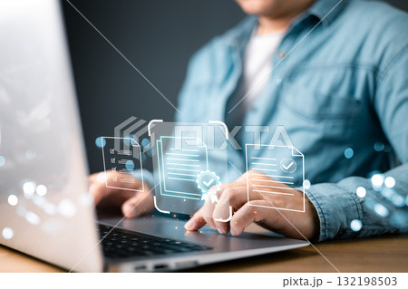 person work on a laptop by floating digital documents featuring verification symbols, a certificate badge, and checkmarks, highlighting authenticity, transparency, and digital leader credibility. person work on a laptop by floating digital documents featuring verification symbols, a certificate badge, and checkmarks, highlighting authenticity, transparency, and digital leader credibility. 132198503