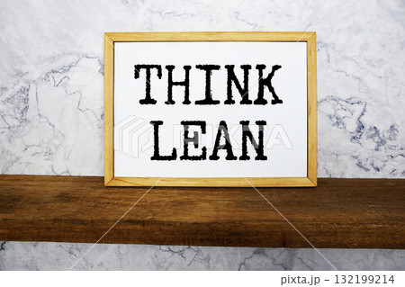 Think Lean text written on whiteboard with wooden shelf and marble background Think Lean text written on whiteboard with wooden shelf and marble background 132199214