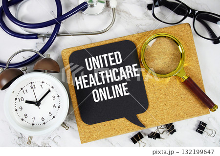 United Healthcare Online text with alarm clock, calculator and stethoscope on marble background United Healthcare Online text with alarm clock, calculator and stethoscope on marble background 132199647