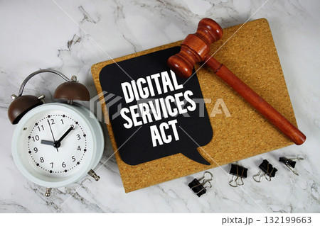 Digital Services Act text on speech bubble with alarm clock and wooden gavel on marble background 132199663
