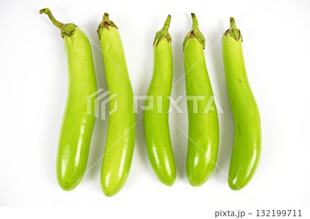 Fresh green long Thai eggplants isolated on white background Fresh green long Thai eggplants isolated on white background 132199711