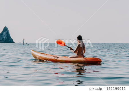 Kayaking, Sea, Paddle: Woman Kayaking in the Ocean on a Calm Day Kayaking, Sea, Paddle: Woman Kayaking in the Ocean on a Calm Day 132199911