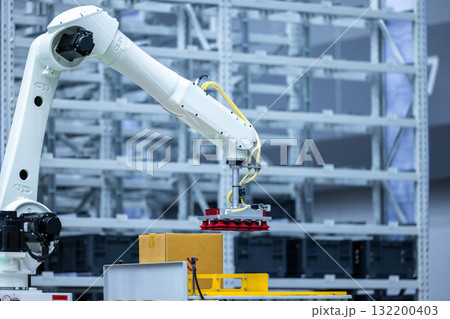 Robotic arm handling boxes on pallets in automated warehouse, Logistics warehouse automation robotics, Robotic arm automated factory packing system efficient industrial box handling and logistics 132200403