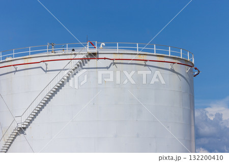 White crude oil storage tanks at petroleum refinery industrial plant, Fuel gas containers in factory area, Energy industry infrastructure, Oil and Gas storage tank blue sky background. 132200410