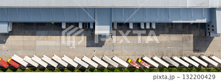 Aerial view modern warehouse for trucks unloading and loading, semi truck cargo trailer at logistic park warehouse, Distribution warehouse shipping supply chain, Business transportation logistic. 132200429