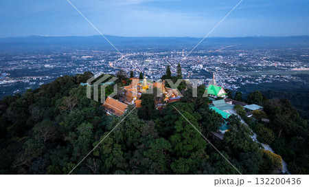 Aerial view of Wat Phra That Doi Suthep temple at twilight in Chiang Mai, Thailand, Wat Phra That Doi Suthep Buddhist temple in Chiang Mai, Famous Thailand Temple in Chaing Mai City background. Aerial view of Wat Phra That Doi Suthep temple at twilight in Chiang Mai, Thailand, Wat Phra That Doi Suthep Buddhist temple in Chiang Mai, Famous Thailand Temple in Chaing Mai City background. 132200436