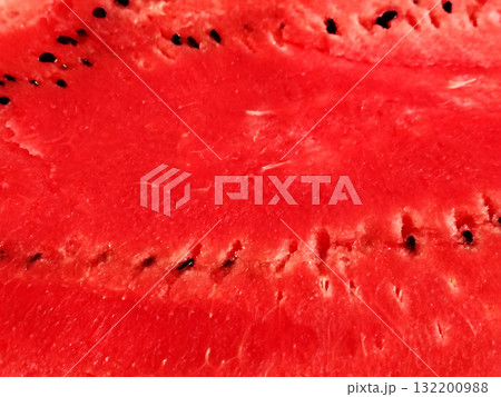 Close-up of the vibrant red flesh of a sliced watermelon. Close-up of the vibrant red flesh of a sliced watermelon. 132200988