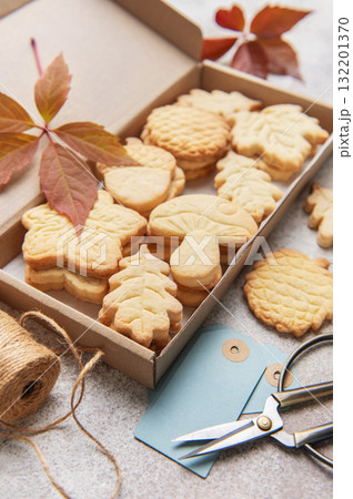 Autumn shaped cookies baking in cardboard gift box Autumn shaped cookies baking in cardboard gift box 132201370