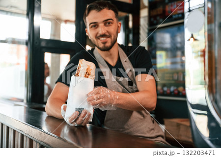 Shawarma man is indoors, conception of street food 132203471