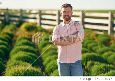 Adult farmer is outdoors Adult farmer is outdoors 132204057