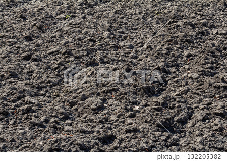 Soil texture after tilling in agricultural field during early morning hours near rural area Soil texture after tilling in agricultural field during early morning hours near rural area 132205382