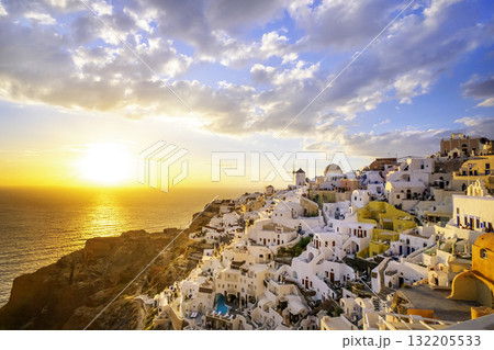 Oia village, Santorini, Greece. sunset view of traditional houses in Santorini. Small narrow streets and rooftops of houses, churches and hotels. Landscape Oia village, Santorini, Greece. sunset view of traditional houses in Santorini. Small narrow streets and rooftops of houses, churches and hotels. Landscape 132205533